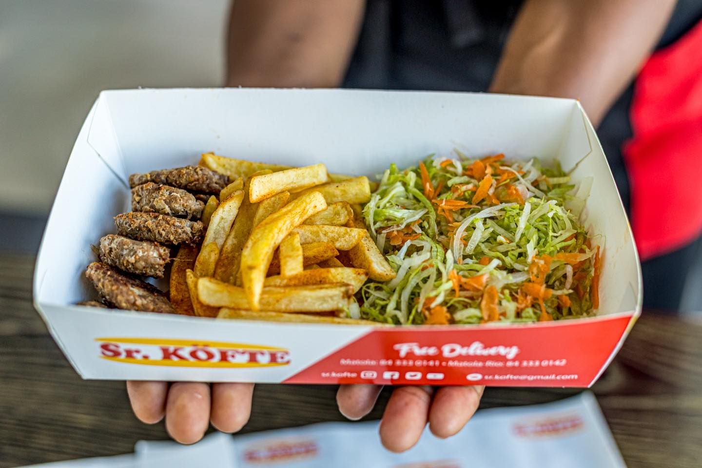 Grilling burgers over fire